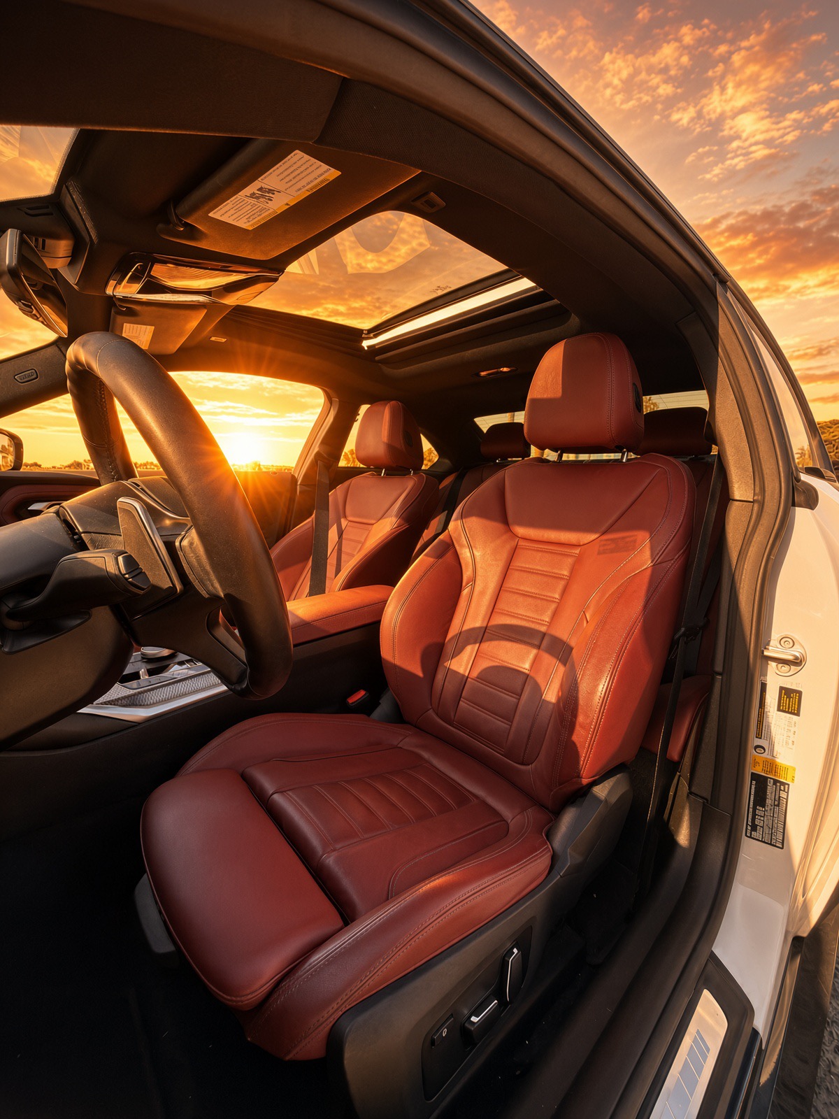 2024 BMW 230i M Package — Red front seats and sunroof