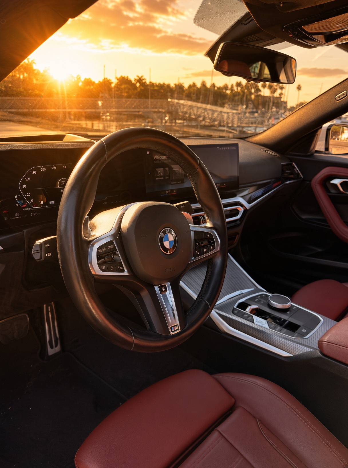 2024 BMW 230i M Package — Steering wheel and dashboard